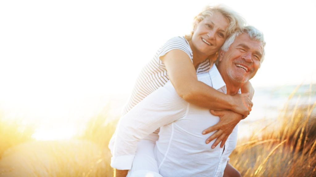 man giving woman piggyback ride