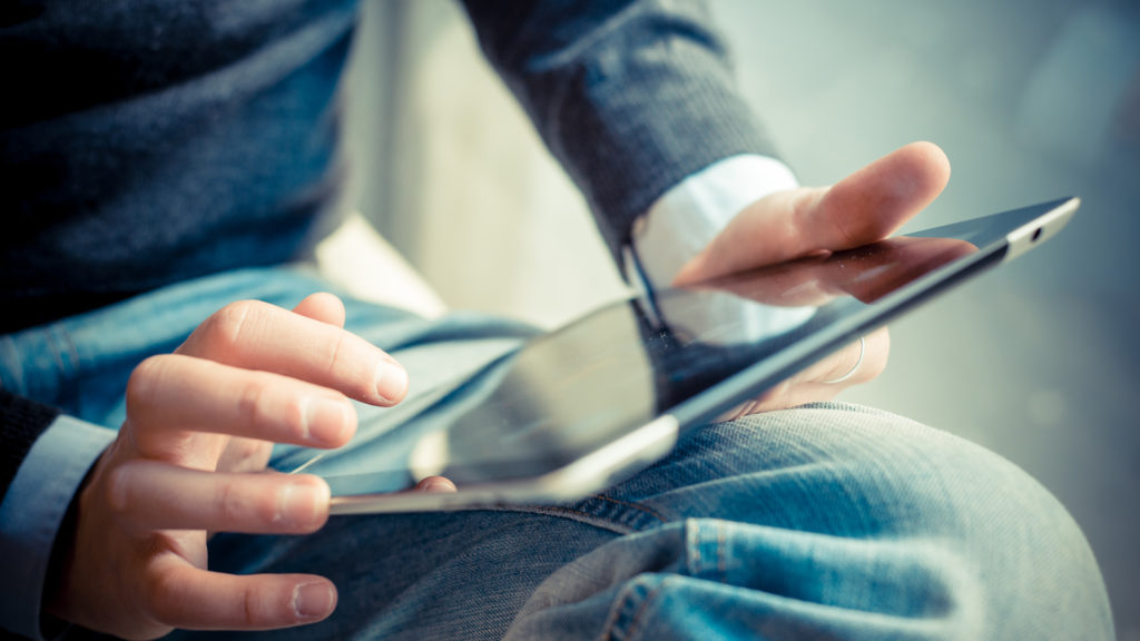 teen on tablet