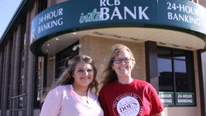 Two ladies in front of RCB Bank's ITM in Claremore