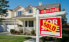SOLD sign in front of house