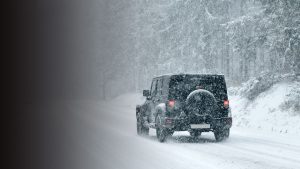 Jeep driving in the snow