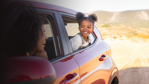 Young girl with mother in car