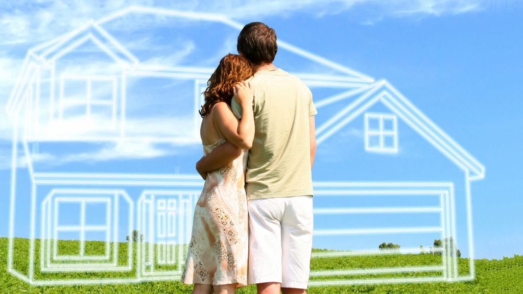 couple looking off into distance at house