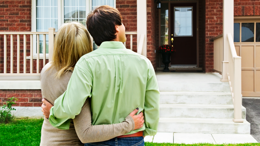 Couple looking at a house.