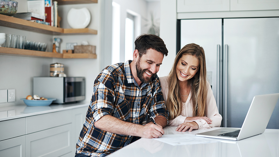 Smiling Couple on Computer