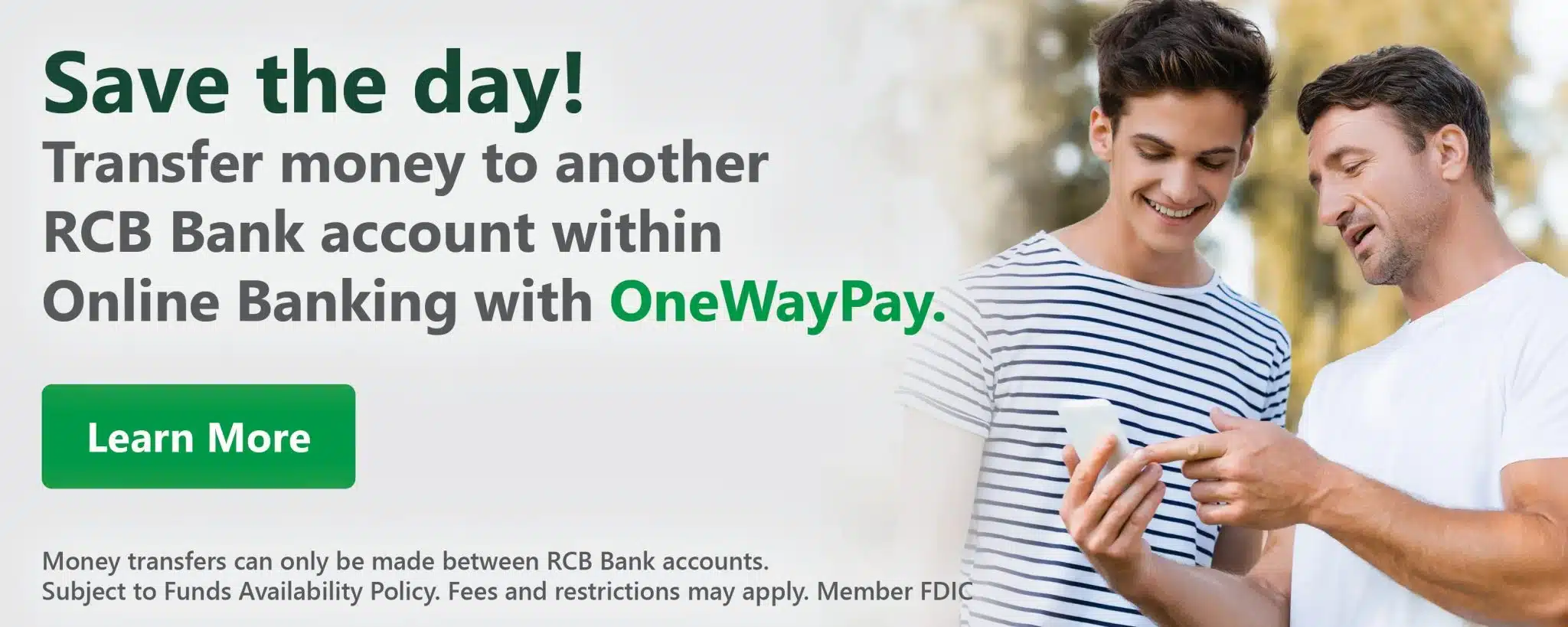 Two men smiling at a smartphone in a park. Text: "Save the day! Transfer money to another RCB Bank account with OneWayPay. Learn More." Reserved footer text below.