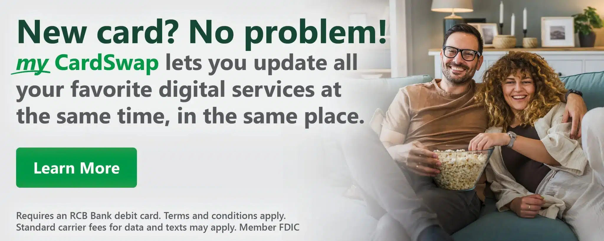 Couple smiling on a couch, holding popcorn, next to text promoting myCardSwap for updating digital services easily. Button reads "Learn More." Relaxed tone.