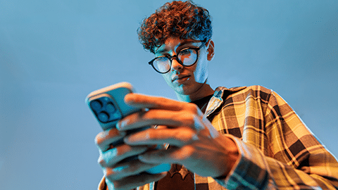 Teen looking at mobile Phone